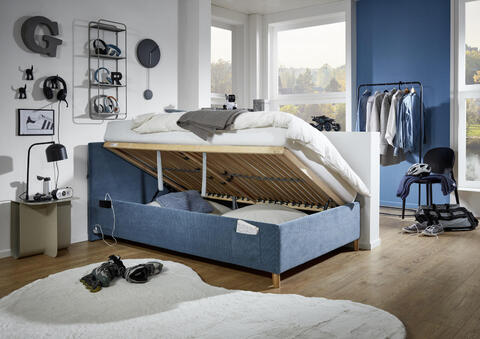 Łóżko tapicerowane z miejscem 140 - Coll niebieski